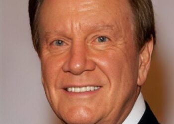 wink martindale hosting classic game show with vintage set backdrop