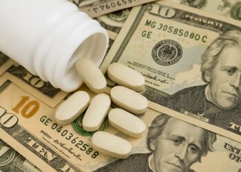 Infographic showing prescription drug prices comparison between the U.S. and other countries with Trump's plan symbolizing a price cut trend.